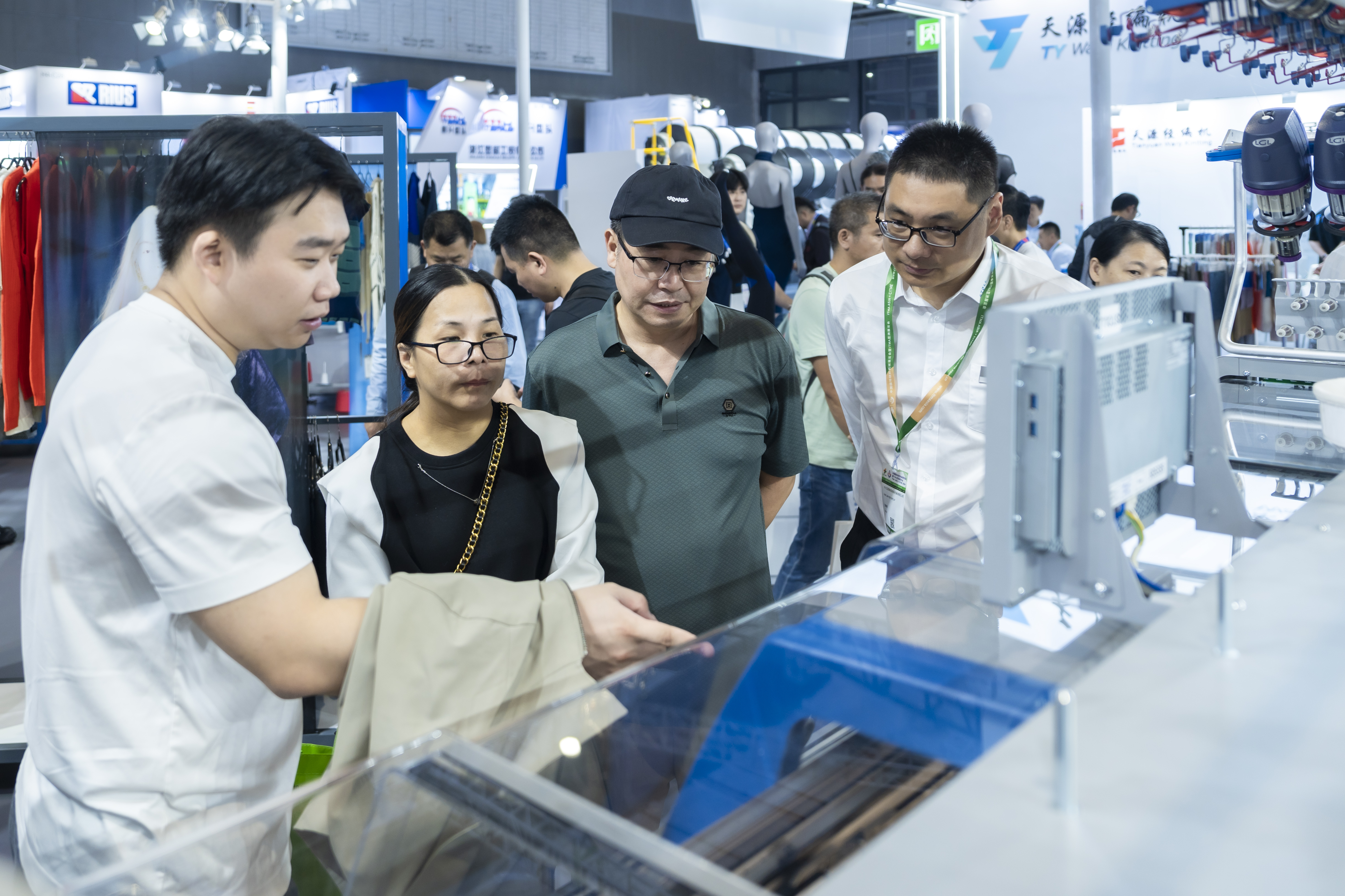 Visitors enjoy Stoll’s exhibits at ITMA ASIA + CITME 2024. © Karl Mayer Group