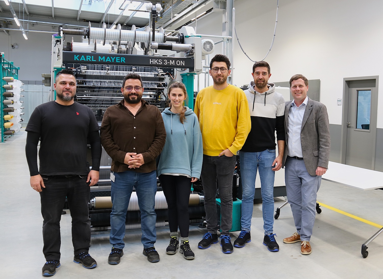 The Team from Ekoten with Senior Sales Manager Bastian Fritsch (right) and trainer Gökhan Akyildiz (left) at the Karl Mayer Academy in Obertshausen. © Karl Mayer Group